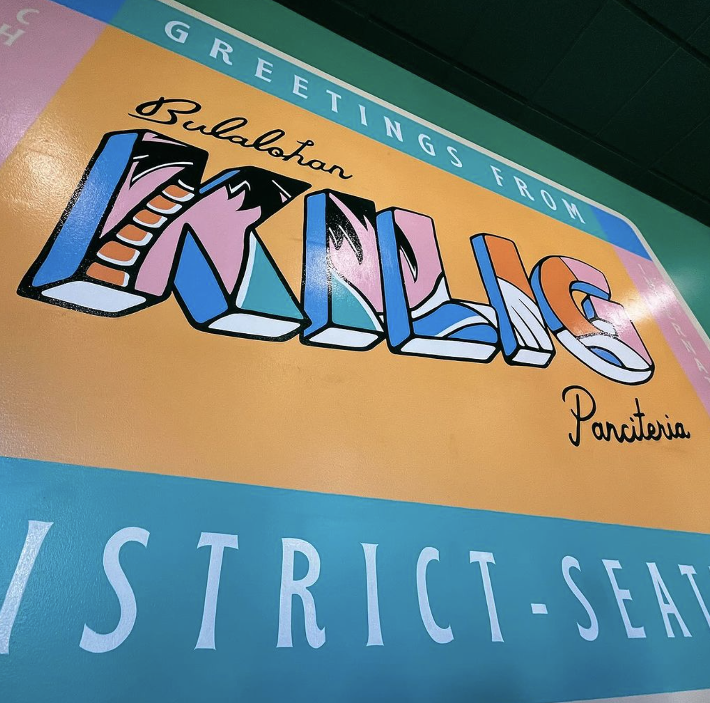 photo of Kilig logo mural inside restaurant